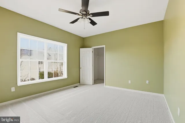 a view of a big room with windows