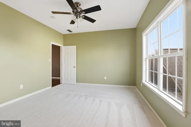 a bathroom with a double vanity sink a mirror and a bathtub