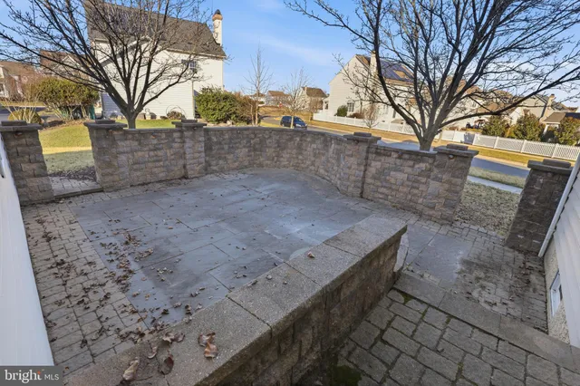 a view of a hallway with wooden shelves