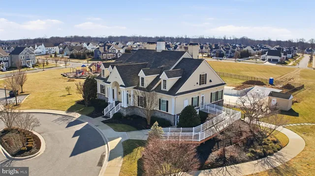 a view of a swimming pool with seating area