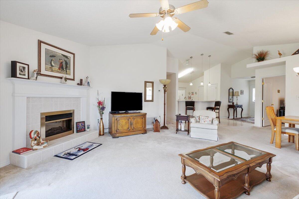 223 Sandy Cay Drive Miramar Beach, FL 32550 - Photo 12 of 25 a living room with furniture a flat screen tv and a fireplace