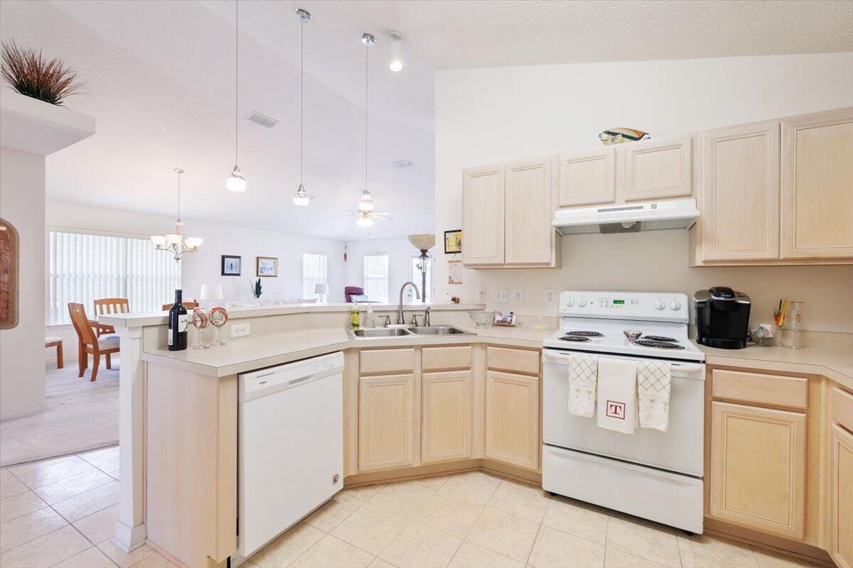 223 Sandy Cay Drive Miramar Beach, FL 32550 - Photo 16 of 25 a kitchen with white cabinets sink and white appliances