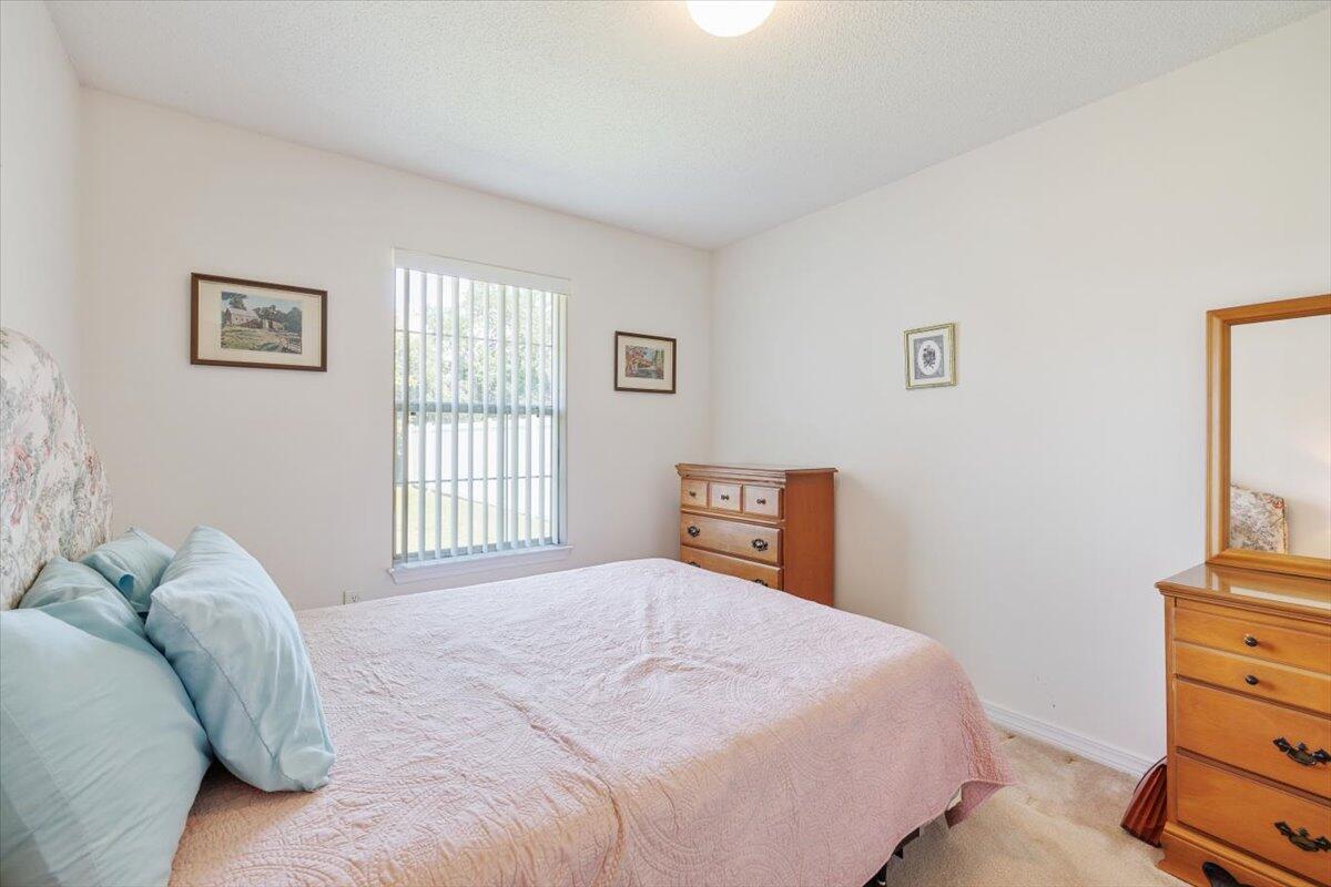 223 Sandy Cay Drive Miramar Beach, FL 32550 - Photo 19 of 25 a bedroom with a bed and a window