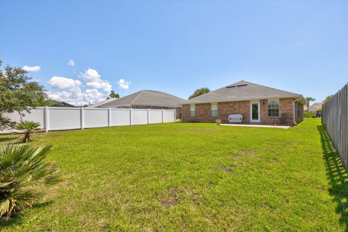 223 Sandy Cay Drive Miramar Beach, FL 32550 - Photo 23 of 25 a front view of a house with garden