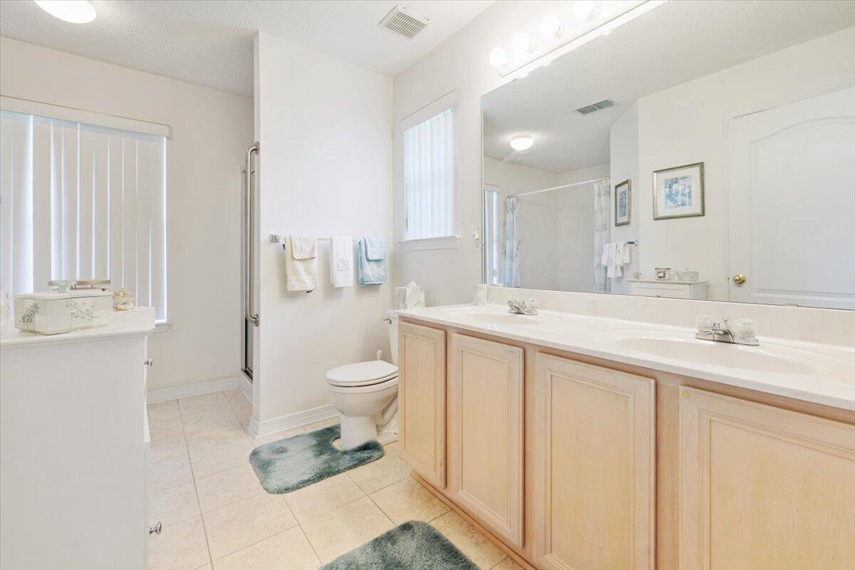 223 Sandy Cay Drive Miramar Beach, FL 32550 - Photo 5 of 25 a bathroom with a sink a toilet and a large mirror