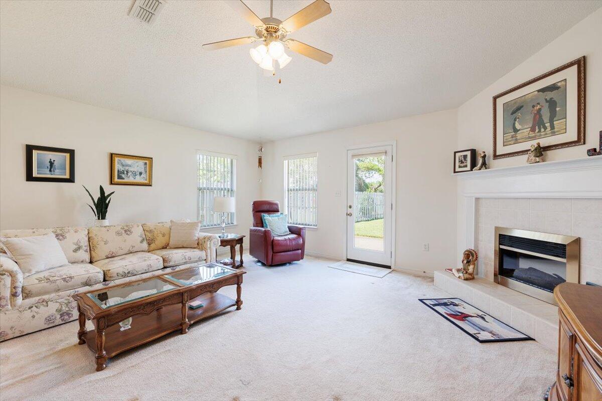 223 Sandy Cay Drive Miramar Beach, FL 32550 - Photo 10 of 25 a living room with furniture and a fireplace
