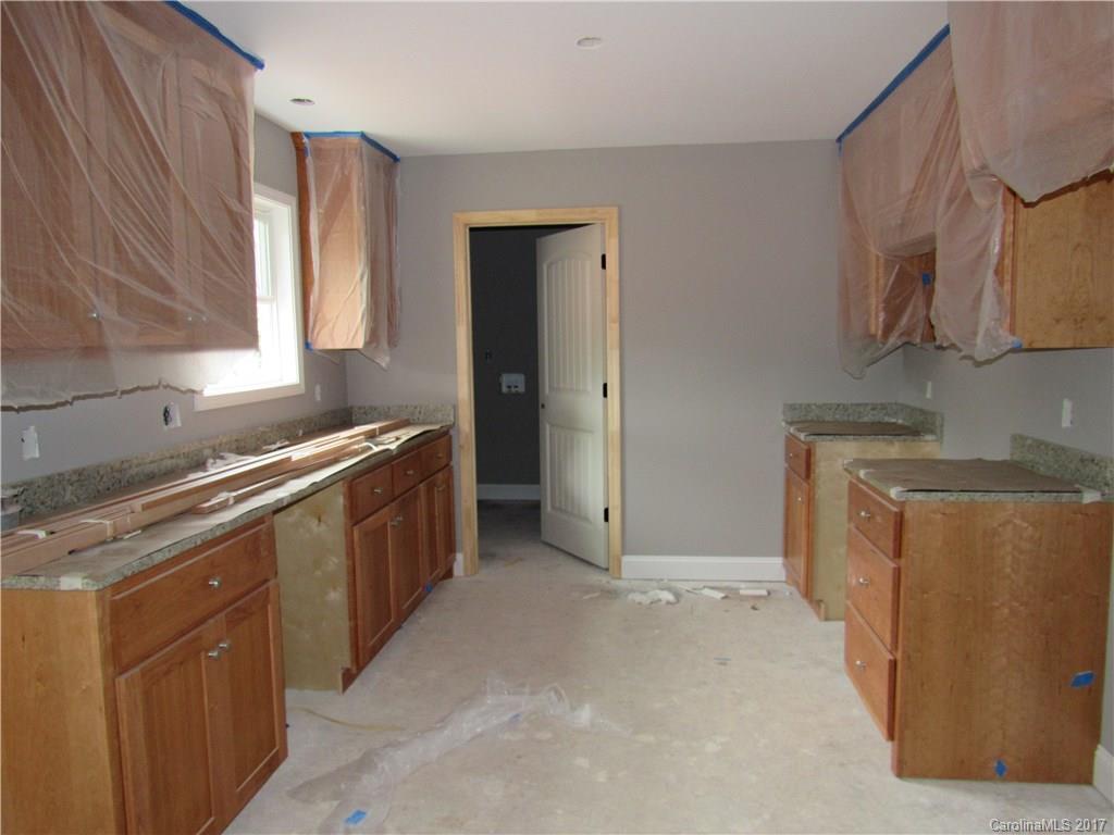 361 Springlake Road York, SC 29745 - Photo 2 of 10 a kitchen with stainless steel appliances granite countertop a sink stove and refrigerator