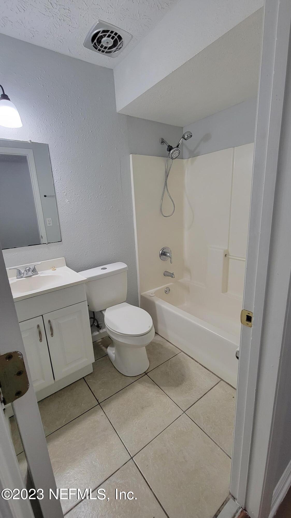 11685 Shellfish Drive Jacksonville, FL 32246 - Photo 17 of 32 a bathroom with a toilet sink and shower