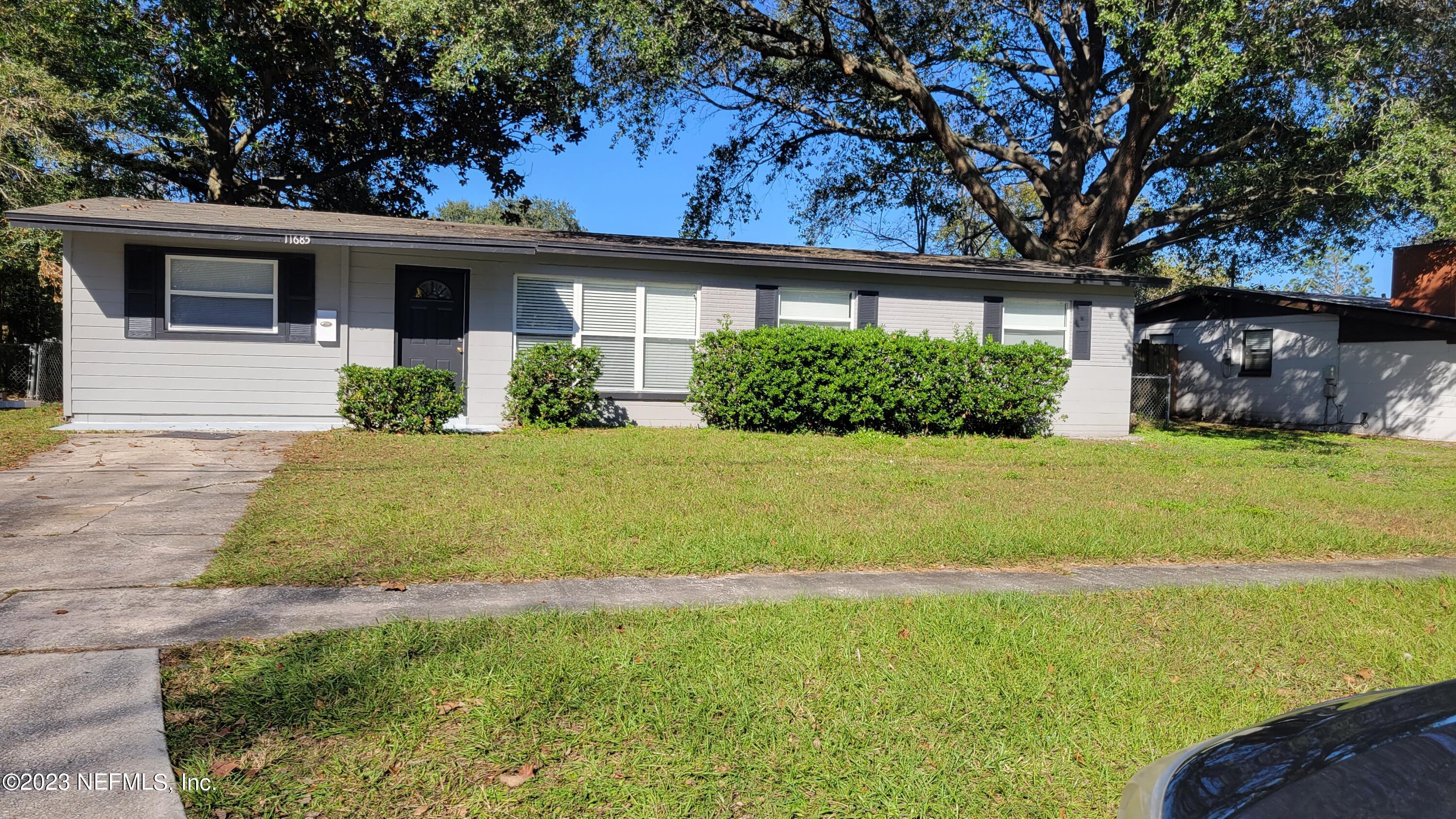 11685 Shellfish Drive Jacksonville, FL 32246 - Photo 2 of 32 a front view of a house with yard and green space