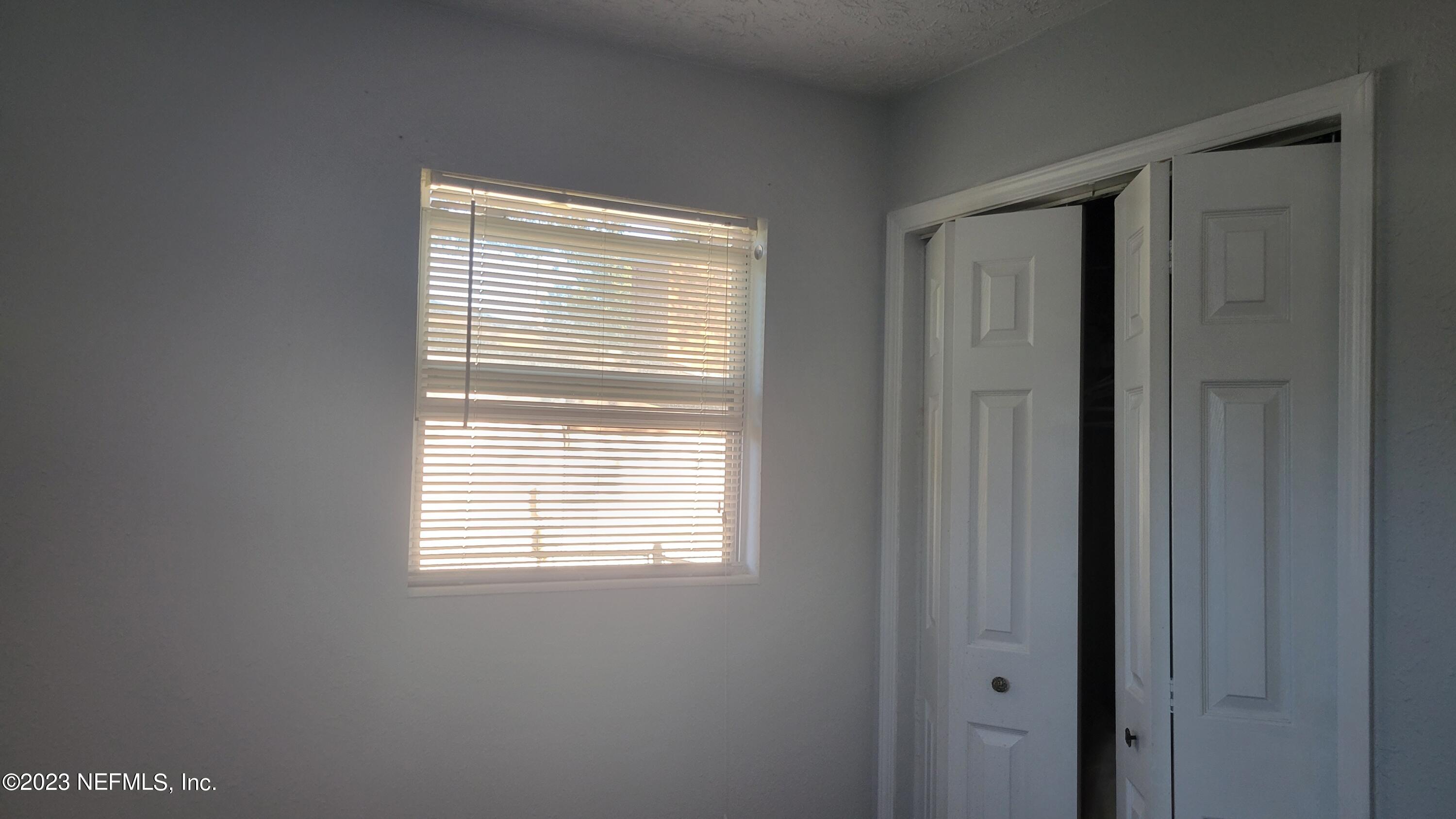 11685 Shellfish Drive Jacksonville, FL 32246 - Photo 28 of 32 a view of an empty room with a window