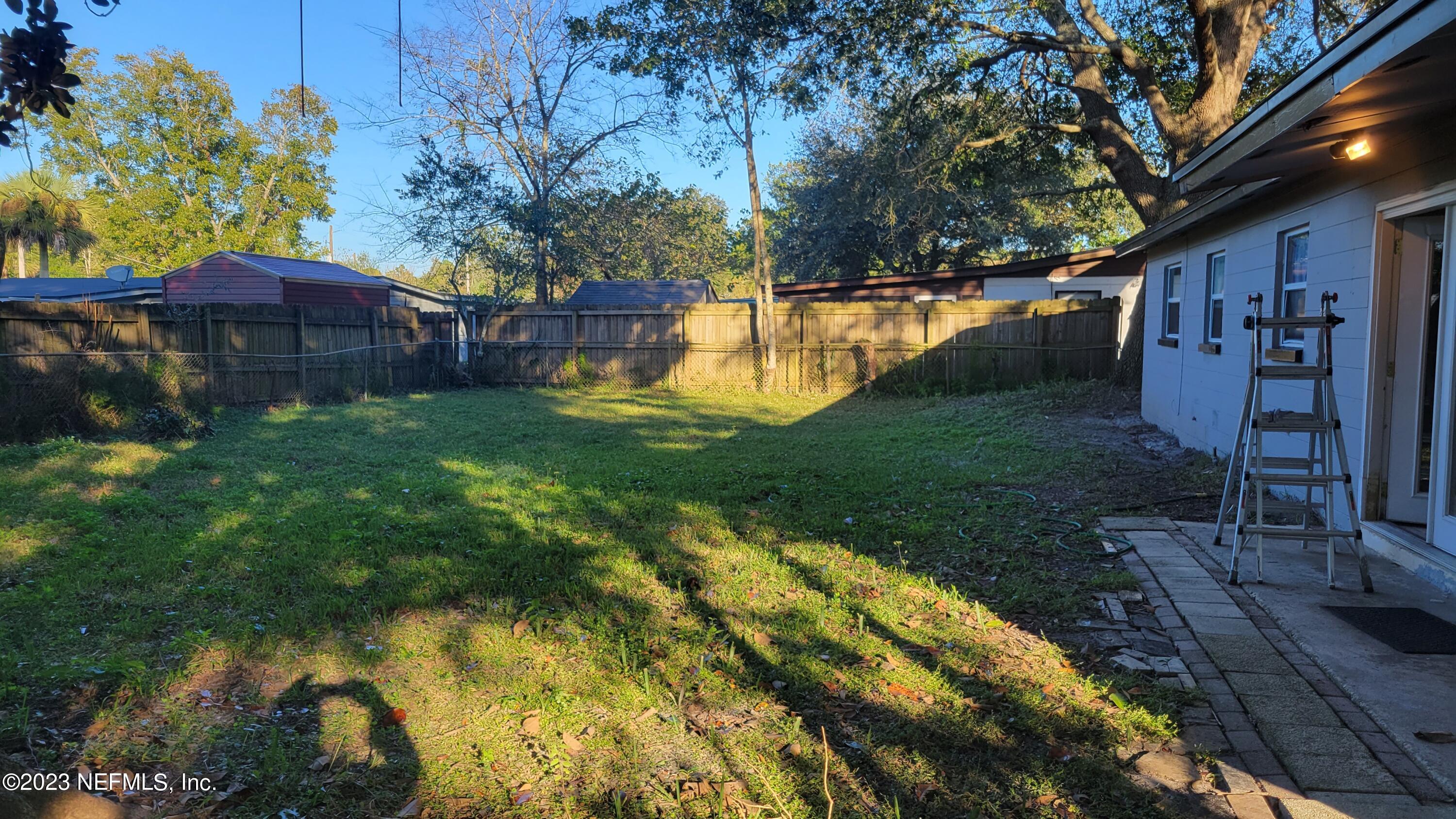 11685 Shellfish Drive Jacksonville, FL 32246 - Photo 31 of 32 a view of a house with a yard