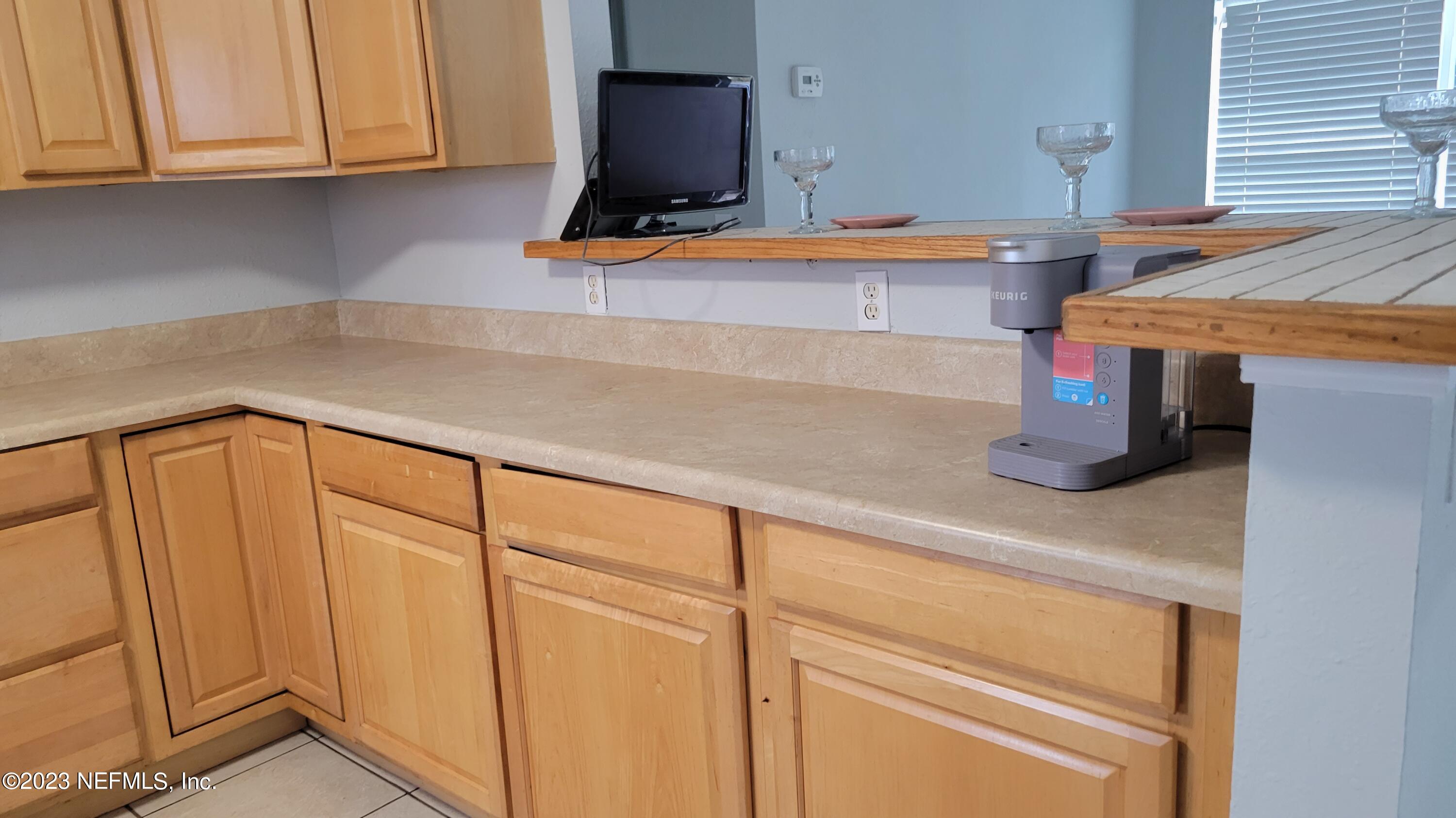 11685 Shellfish Drive Jacksonville, FL 32246 - Photo 9 of 32 a kitchen with stainless steel appliances granite countertop a sink and cabinets