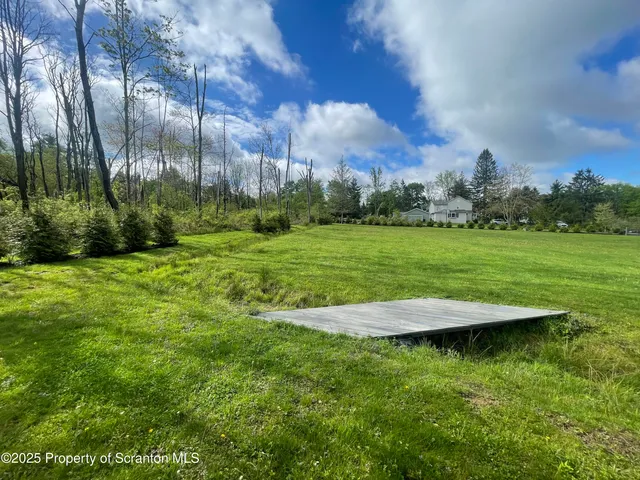 a view of a golf course with a lake