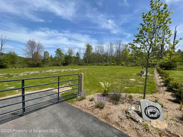 a view of a lake with a yard