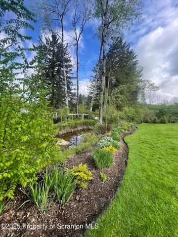 a view of a garden with a building