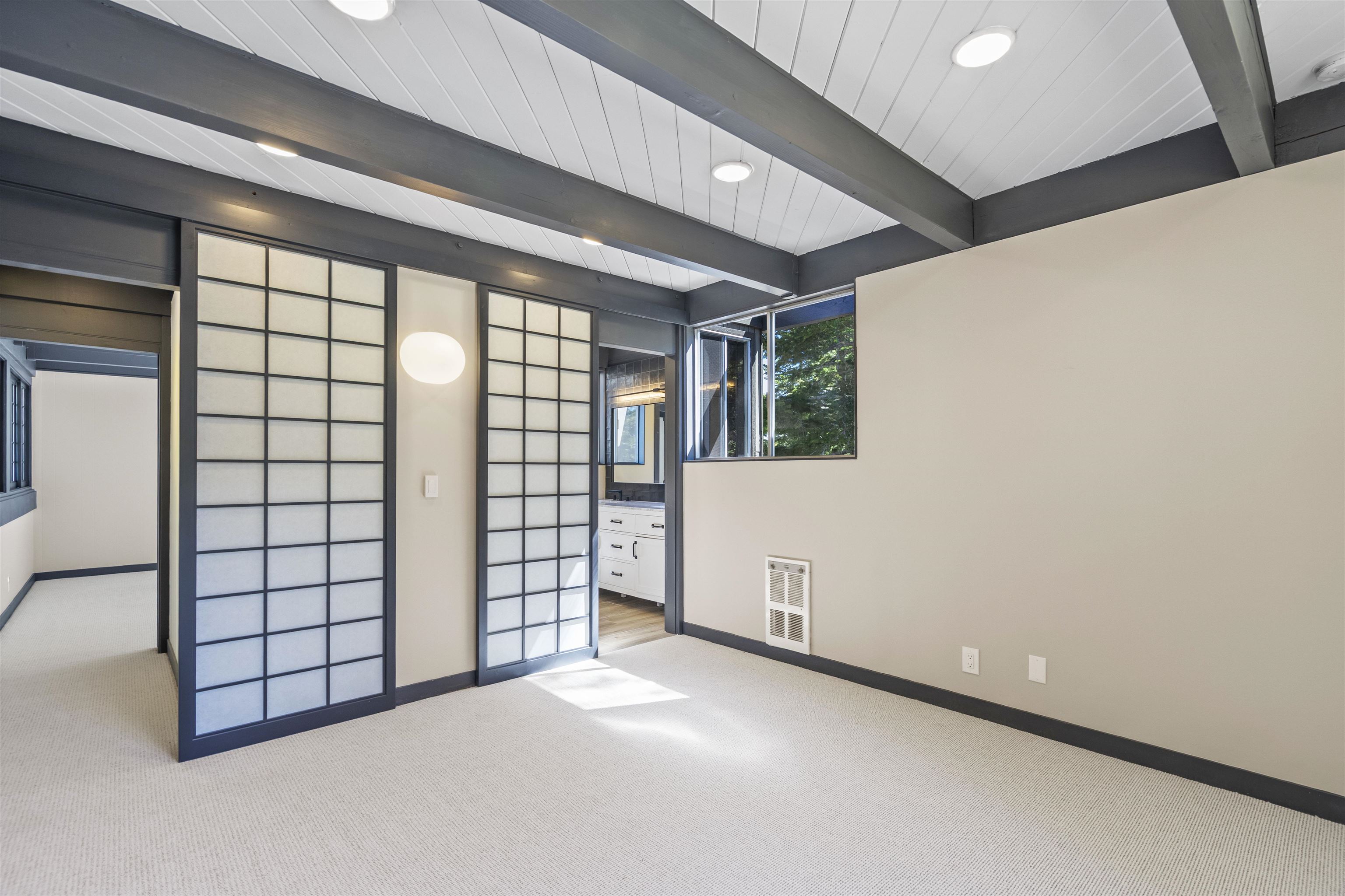 2570 Old Mammoth Road Mammoth Lakes, CA 93546 - Photo 14 of 39 Room featuring exposed beam ceilings, recessed lighting, expansive carpeted flooring, and shoji scre