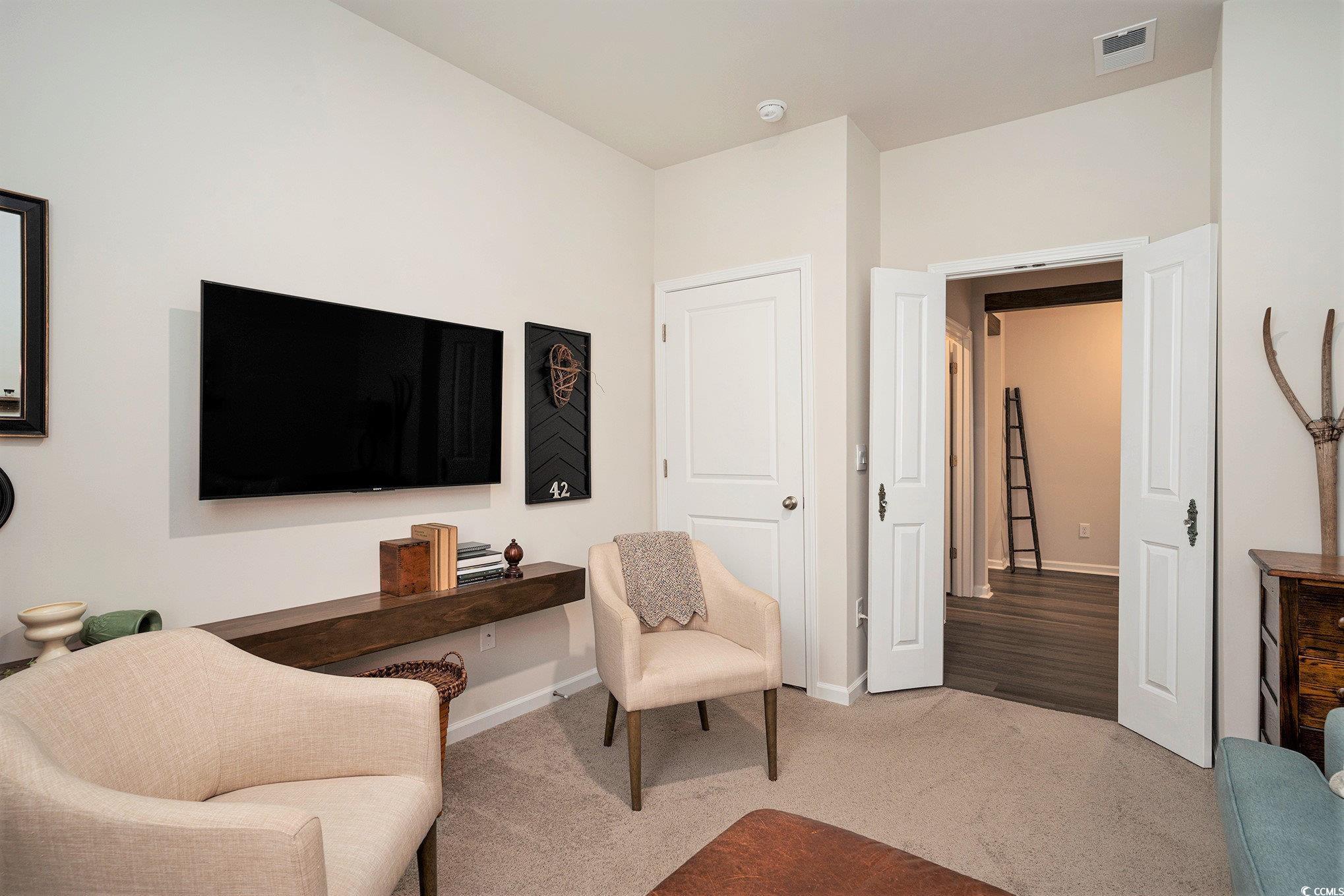 132 Columbus Street Conway, SC 29526 - Photo 19 of 39 Sitting room with carpet floors and baseboards