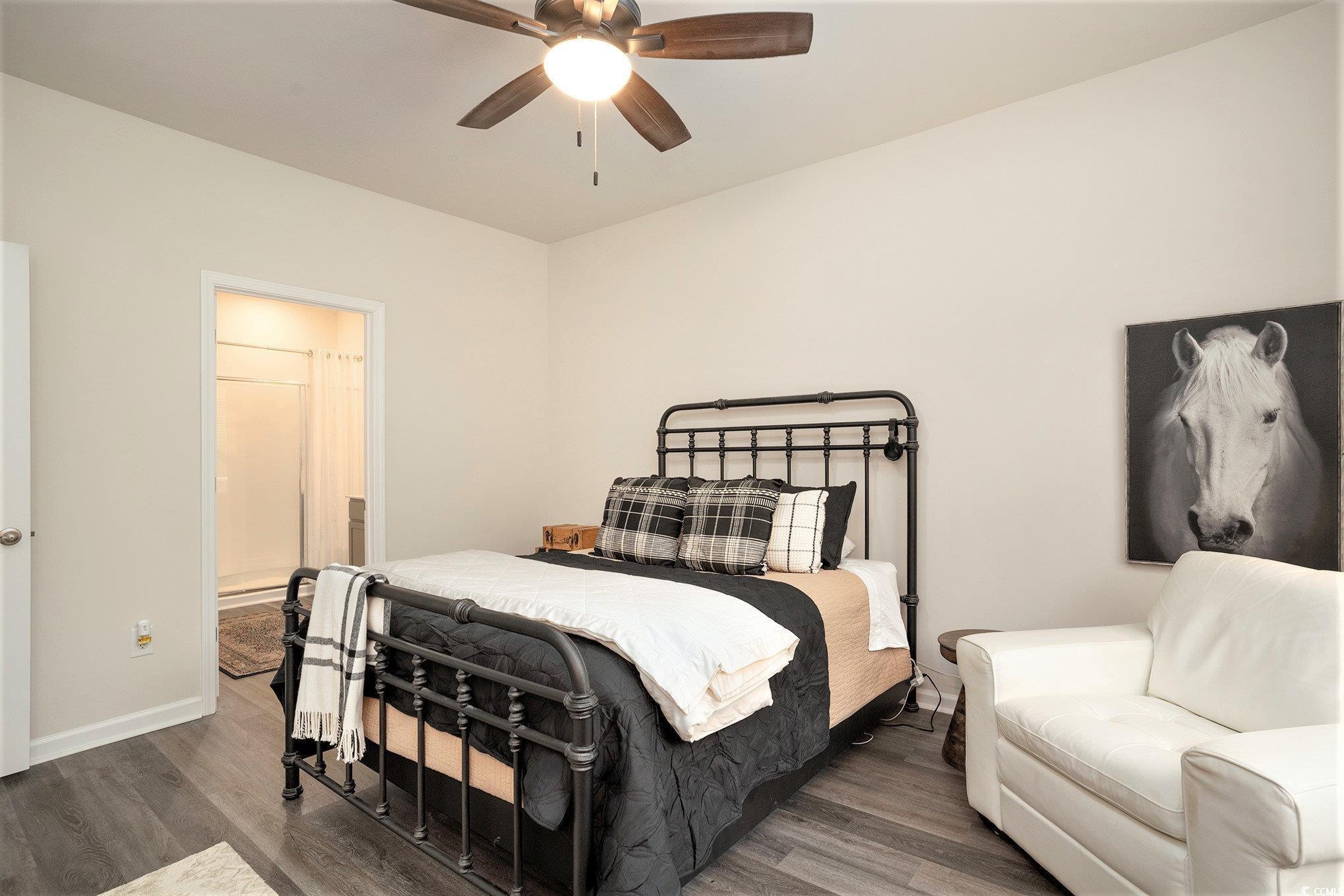 132 Columbus Street Conway, SC 29526 - Photo 21 of 39 Bedroom featuring wood finished floors, a ceiling fan, and ensuite bath
