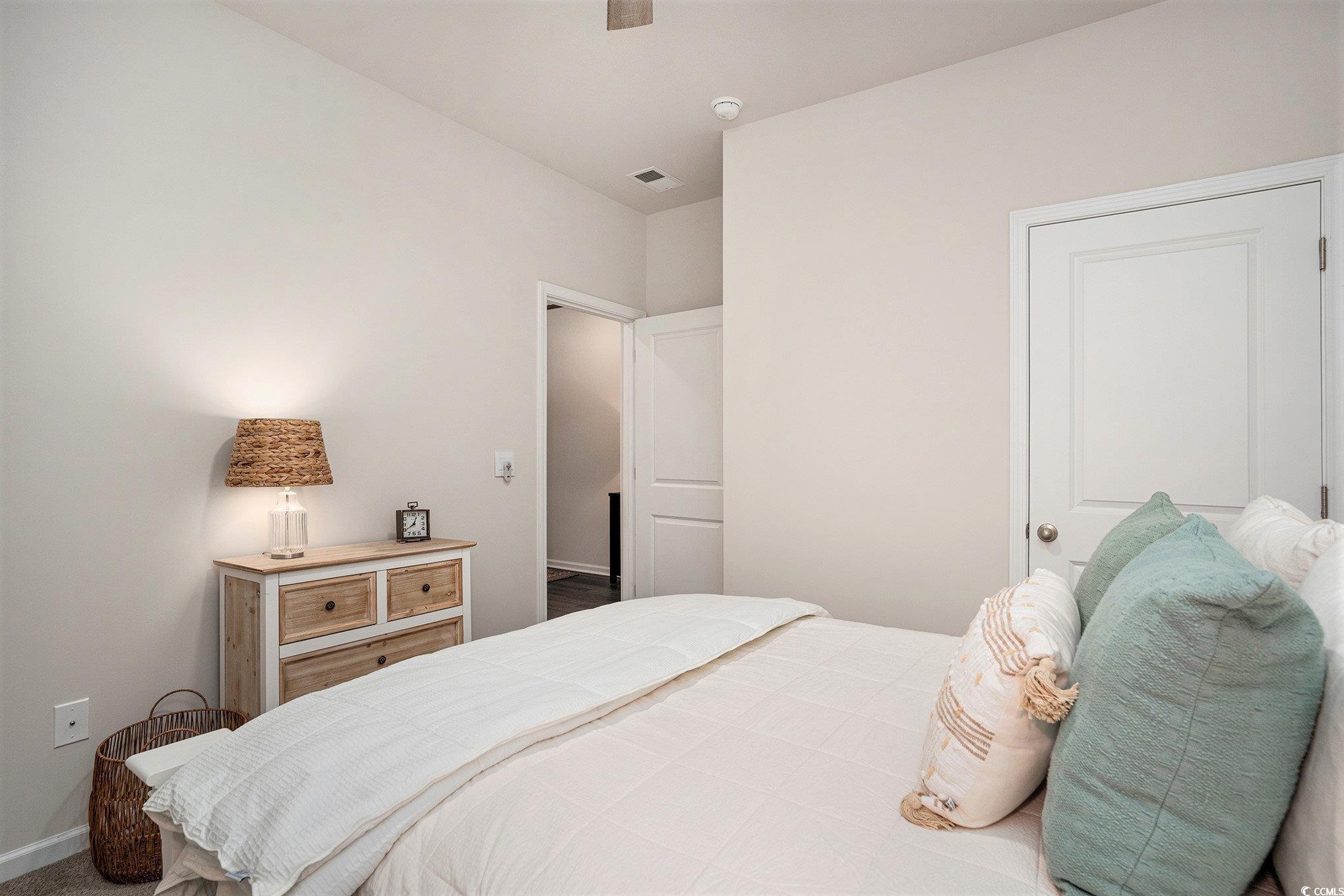 132 Columbus Street Conway, SC 29526 - Photo 29 of 39 Bedroom with a ceiling fan and dark carpet