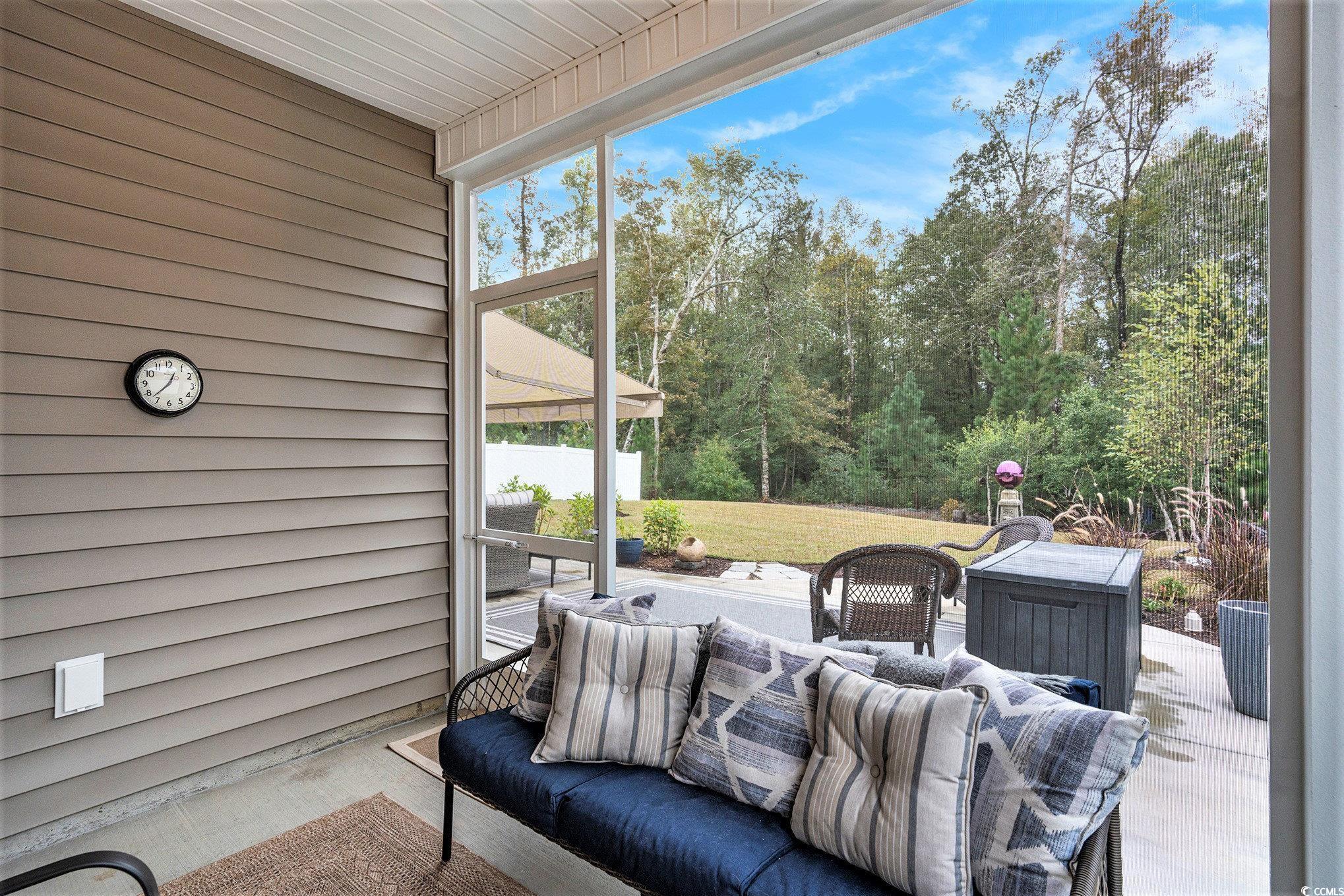 132 Columbus Street Conway, SC 29526 - Photo 31 of 39 Sunroom / solarium featuring a patio area, ceiling fan, and a chandelier