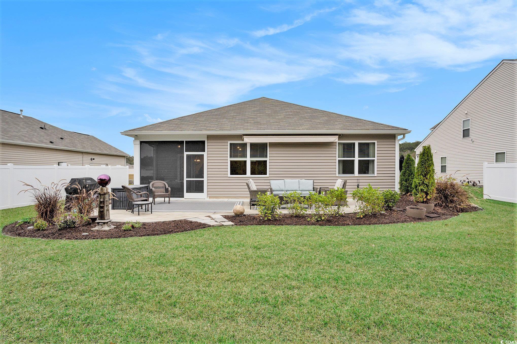 132 Columbus Street Conway, SC 29526 - Photo 34 of 39 Back of property with a patio area, a sunroom, an outdoor living space, and a shingled roof