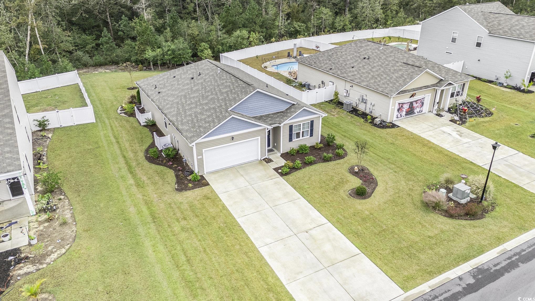 132 Columbus Street Conway, SC 29526 - Photo 37 of 39 Back of house with a fenced backyard, a patio, and roof with shingles