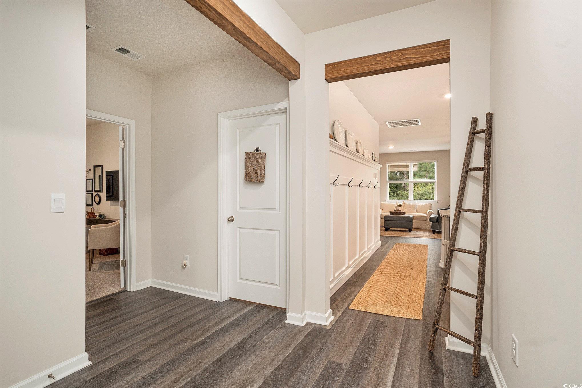 132 Columbus Street Conway, SC 29526 - Photo 5 of 39 Hallway featuring dark wood-type flooring and baseboards