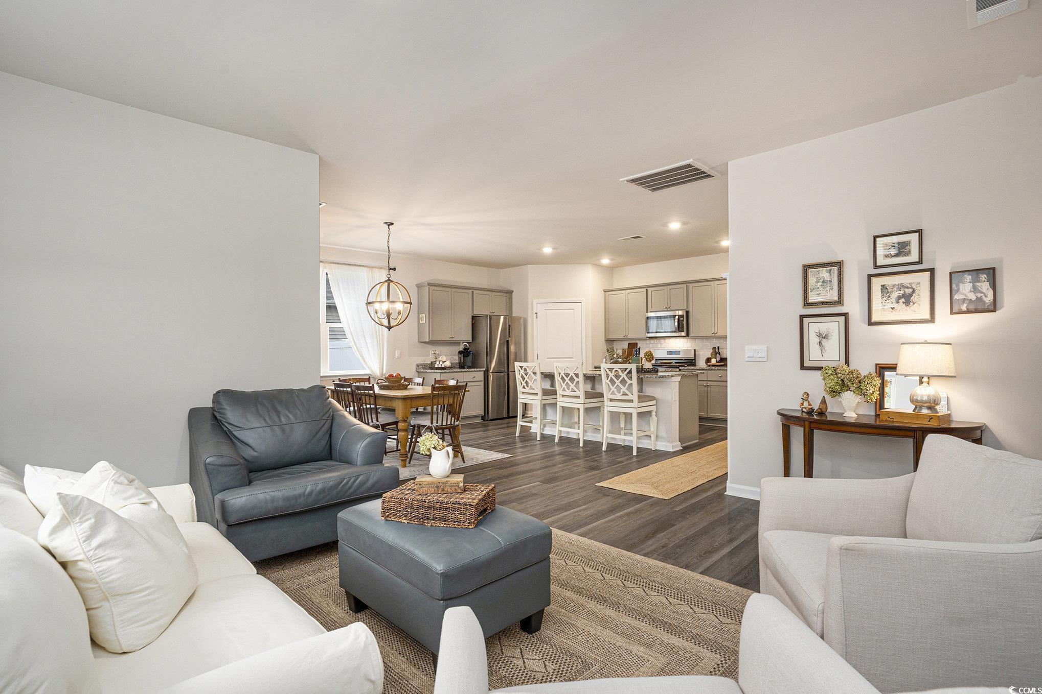 132 Columbus Street Conway, SC 29526 - Photo 9 of 39 Living room featuring dark wood-style floors, recessed lighting, and a chandelier