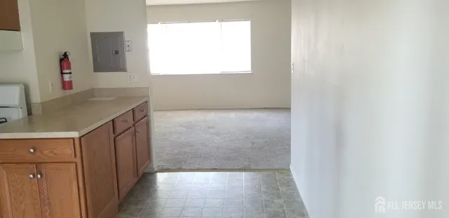 a bathroom with a granite countertop sink a mirror and a vanity