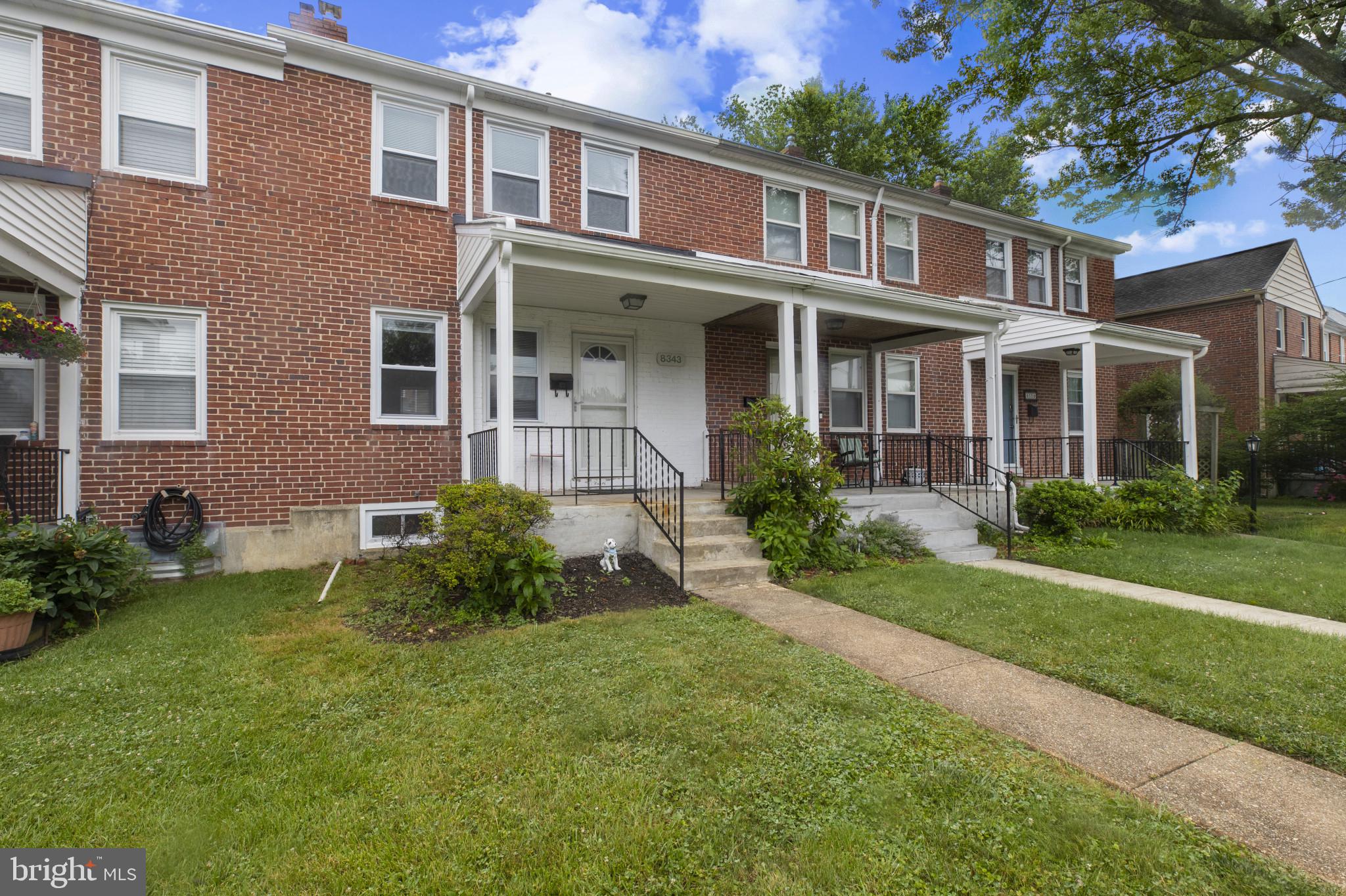 8343 Ridgely Oak Road Parkville, MD 21234 - Photo 1 of 31 a view of a brick building next to a yard