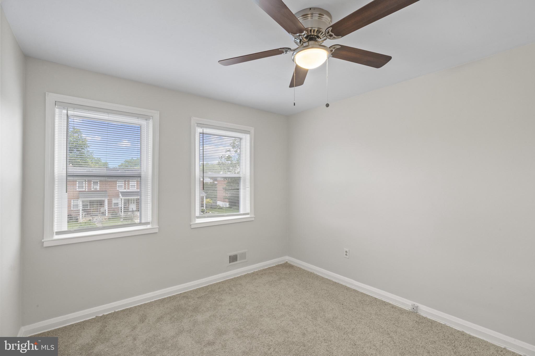 8343 Ridgely Oak Road Parkville, MD 21234 - Photo 17 of 31 an empty room with a window and a fan