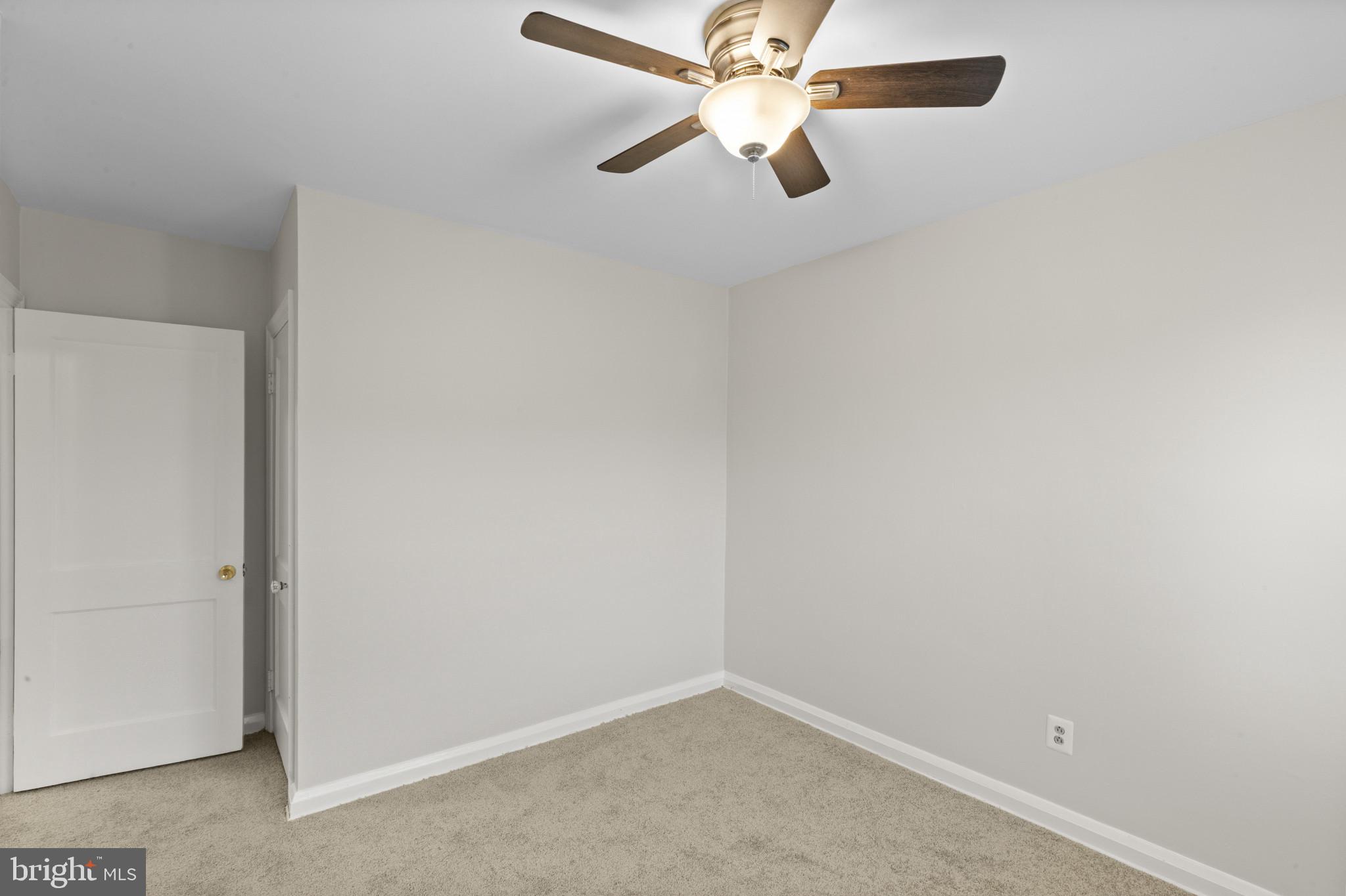 8343 Ridgely Oak Road Parkville, MD 21234 - Photo 21 of 31 an empty room with a fan and a fan