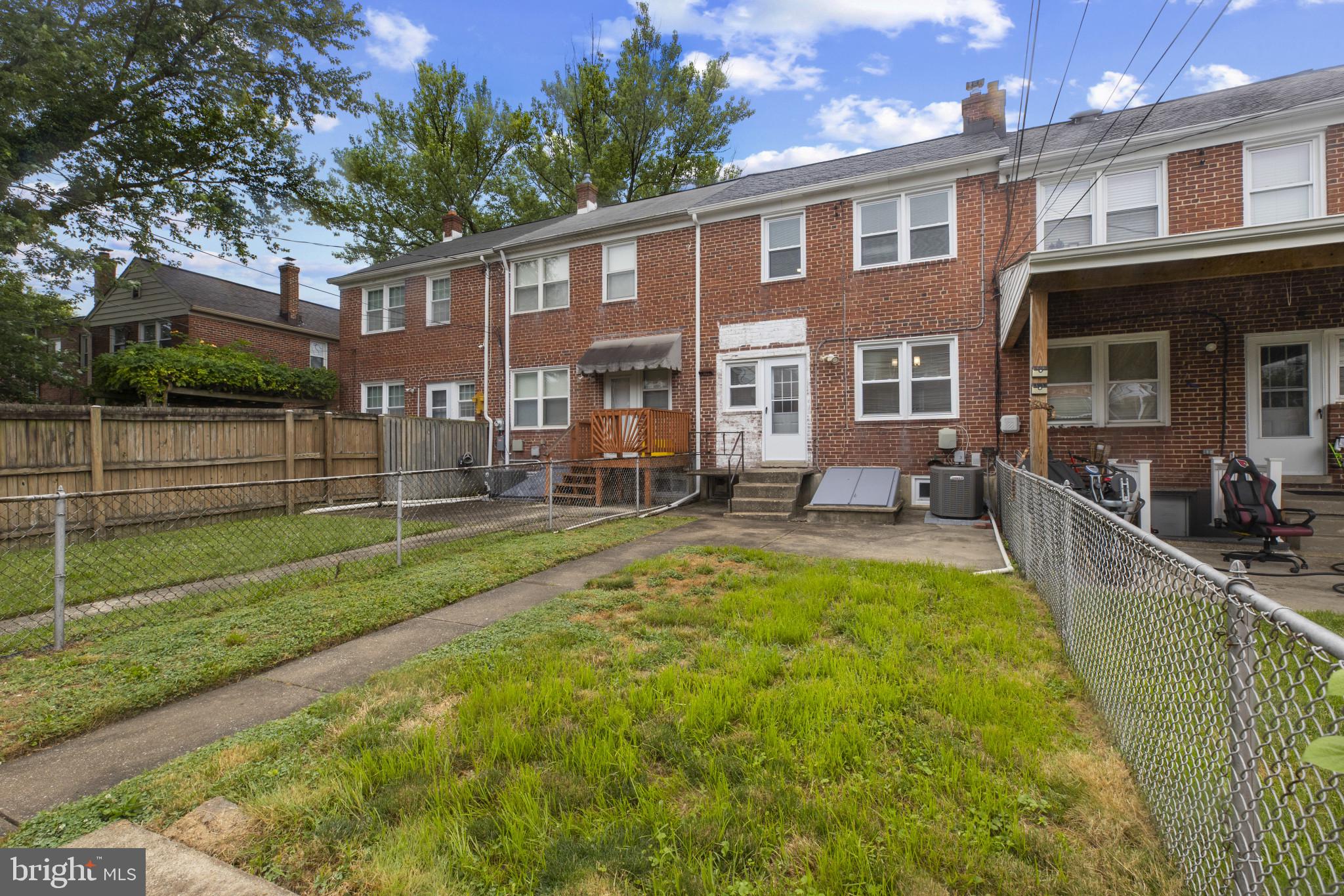 8343 Ridgely Oak Road Parkville, MD 21234 - Photo 27 of 31 a view of a house with a yard patio and swimming pool