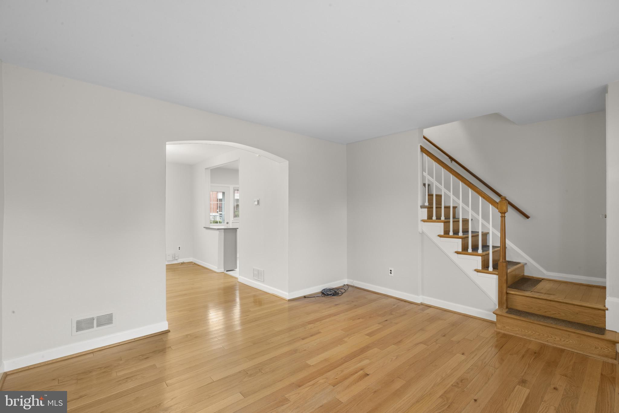 8343 Ridgely Oak Road Parkville, MD 21234 - Photo 7 of 31 a view of an empty room with wooden floor and entryway