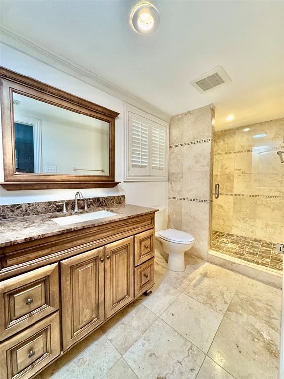 6712 Timothy Drive Dallas, TX 75227 - Photo 9 of 20 Full bathroom featuring vanity and a stall shower