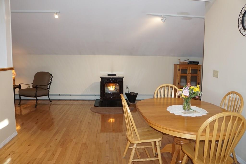213 Shaker Hill Road Alfred, ME 04002 - Photo 26 of 35 Dining Area and view of the Pellet Stove