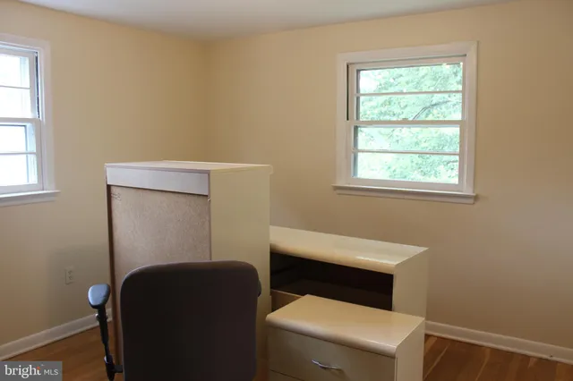 a bathroom with a toilet sitting next to a window