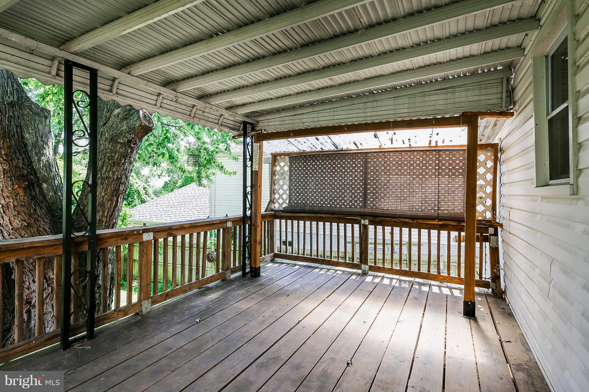 4117 Old Washington Road Baltimore, MD 21227 - Photo 24 of 27 a view of porch with wooden floor
