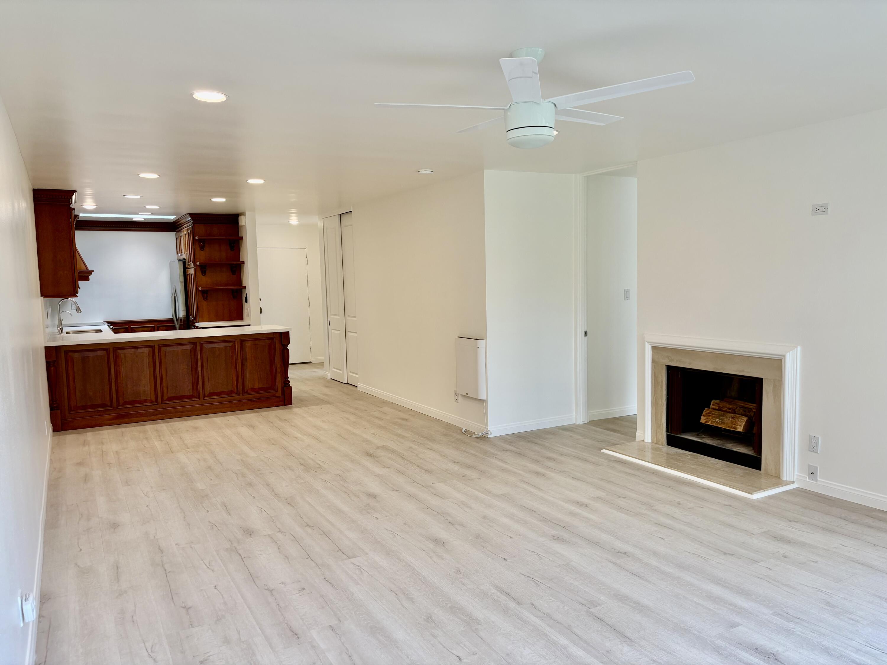 1220 Coast Village Road, Unit 304 Santa Barbara, CA 93108 - Photo 3 of 17 Kitchen and fireplace from living- nice