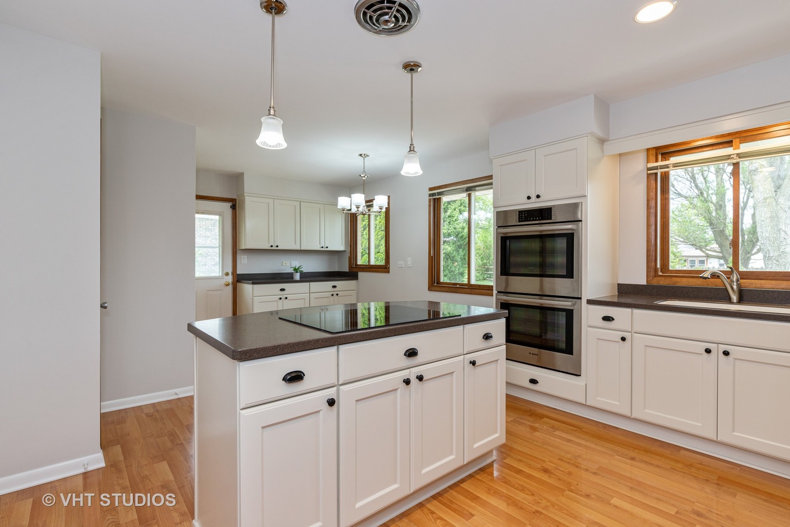 411 Beck Road Lindenhurst, IL 60046 - Photo 2 of 18 a kitchen with stainless steel appliances granite countertop a sink a stove a refrigerator and cabinets