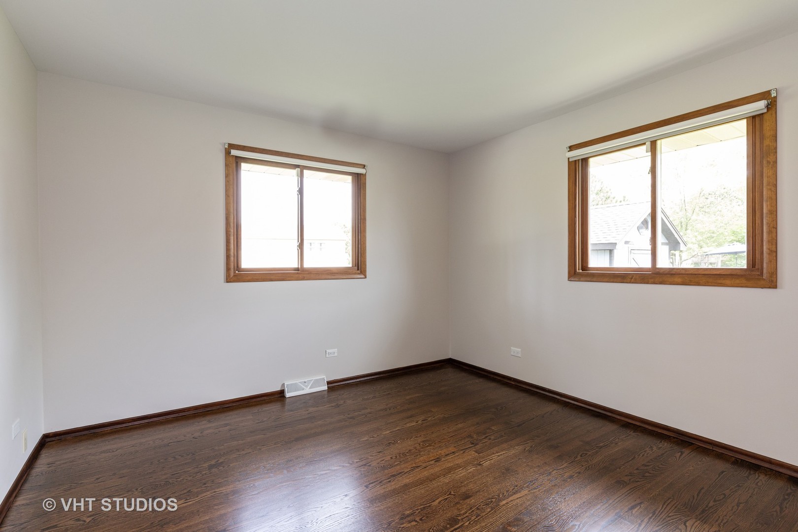 411 Beck Road Lindenhurst, IL 60046 - Photo 11 of 18 a view of an empty room with wooden floor and a window