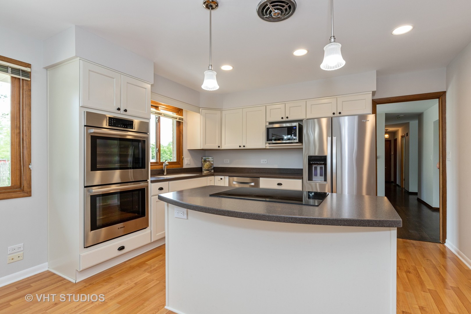 411 Beck Road Lindenhurst, IL 60046 - Photo 3 of 18 a kitchen with kitchen island a counter space a sink and stainless steel appliances