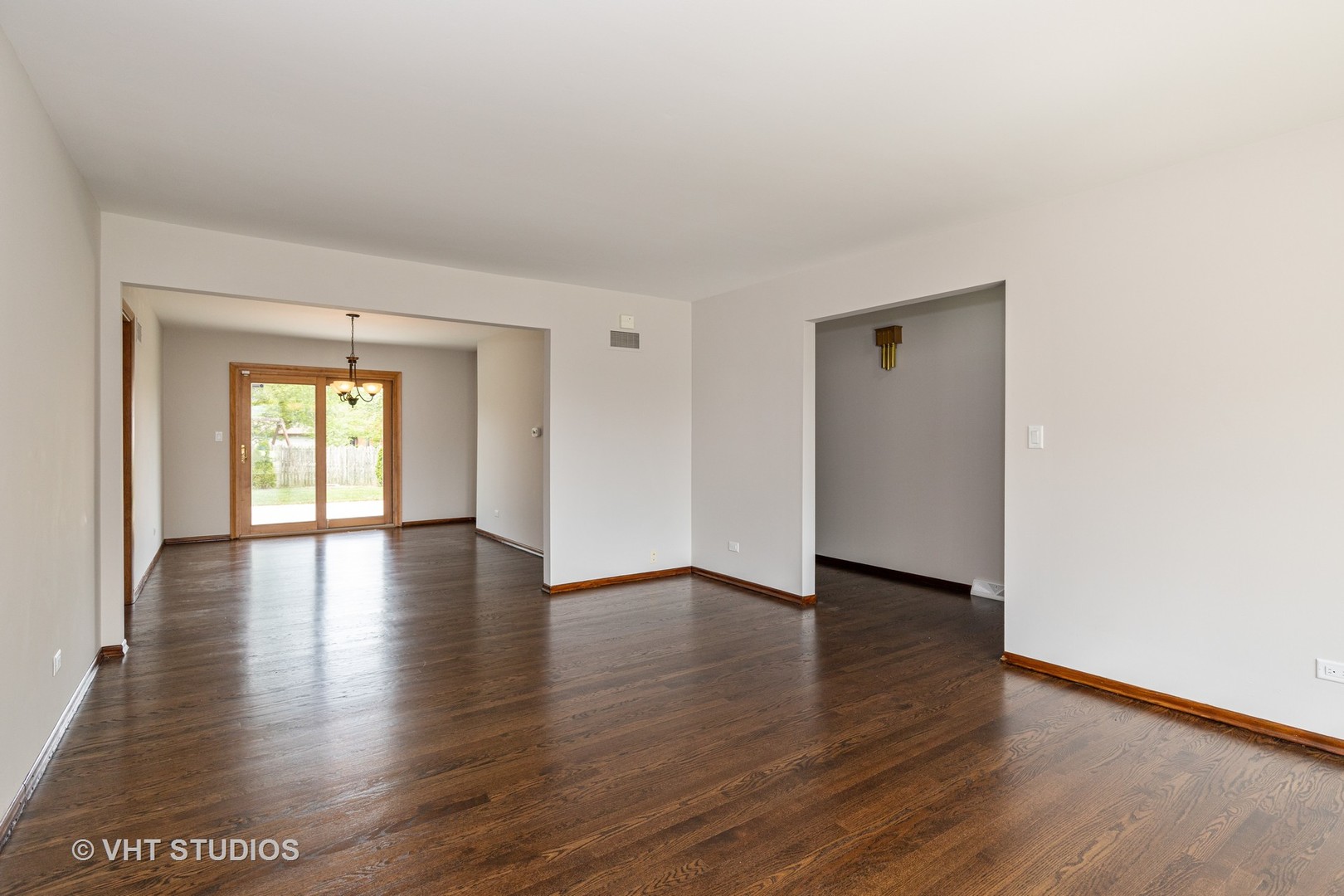 411 Beck Road Lindenhurst, IL 60046 - Photo 6 of 18 a view of an empty room with wooden floor and a window