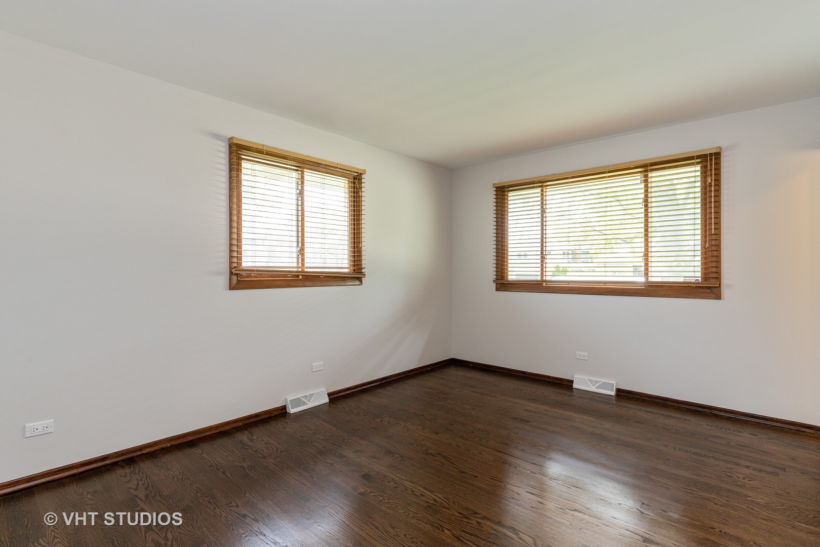 411 Beck Road Lindenhurst, IL 60046 - Photo 8 of 18 a view of an empty room with wooden floor and a window