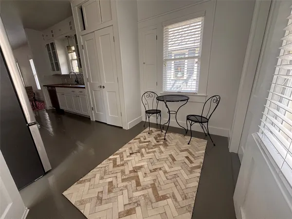 a bedroom with furniture and a window