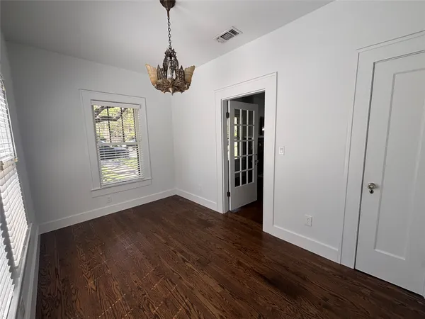 a bathroom with a sink a toilet a shower and a mirror
