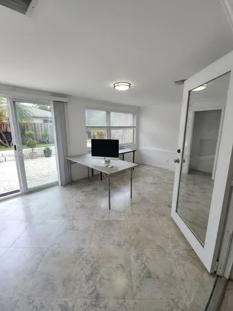 a bathroom with a granite countertop sink a toilet and bathtub