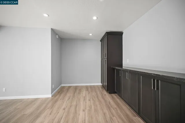 a view of hallway with wooden floor