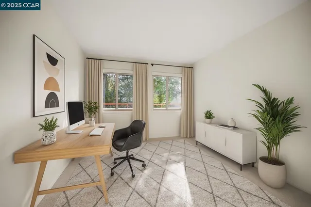 a living room with furniture and a potted plant