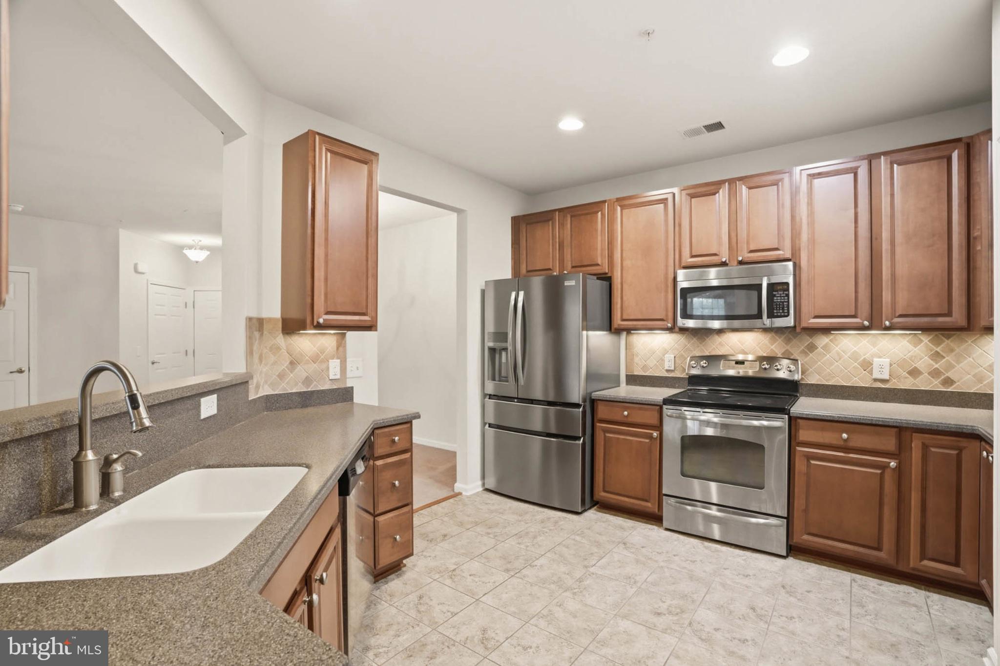 1622 Hardwick Court, Unit 202 Hanover, MD 21076 - Photo 17 of 60 Modern kitchen with rich cabinetry.